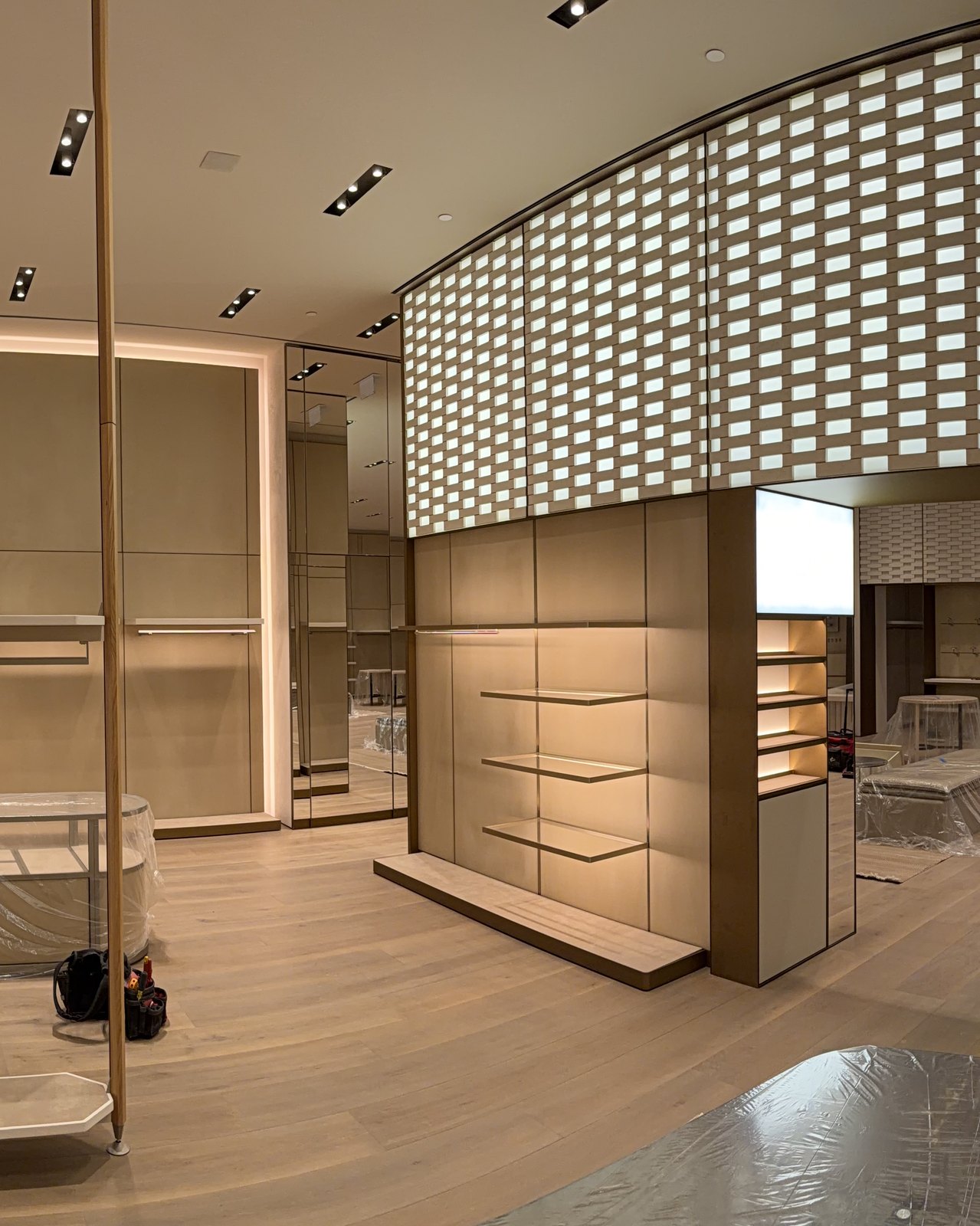 Custom millwork with integrated lighting and paneled wall joinery